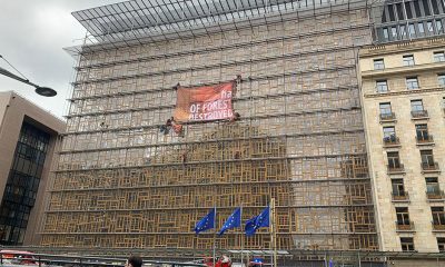 Greenpeace activists scale EU building in protest at deforestation