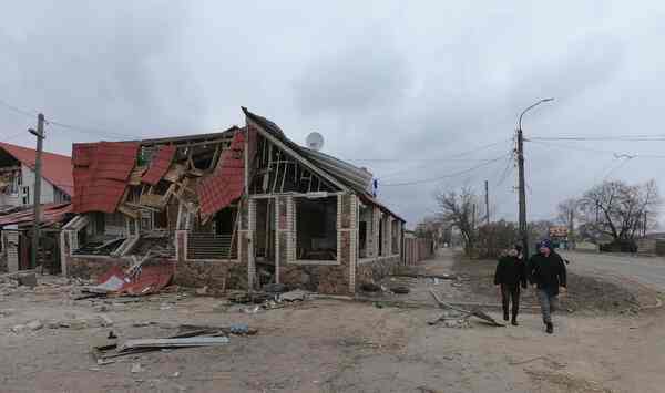 Red-shingled houses with their roofs falling off.