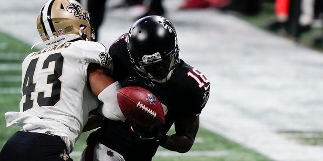 New Orleans Saints free safety Marcus Williams (43) hits Atlanta Falcons wide receiver Calvin Ridley (18) during the second half of an NFL football game, Sunday, Dec. 6, 2020, in Atlanta.