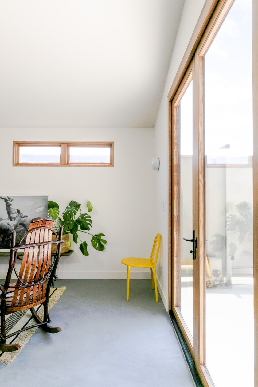 An interior shot that shows a bifold door facing a patio.