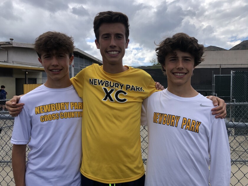 Nico Young poses for a photo with twin brothers Leo (left) and Lex. 