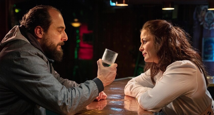 A sad man and an attentive female bartender in "On My Mind." 