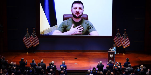 Speaker of the House Nancy Pelosi, D-Calif., introduces Ukrainian President Volodymyr Zelenskyy to speak to the U.S. Congress by video at the Capitol in Washington, Wednesday, March 16, 2022.