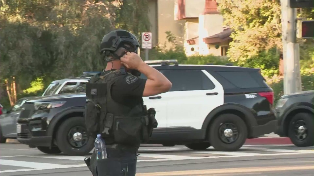 Police take man accused of robbery into custody after 8-hour standoff in Woodland Hills