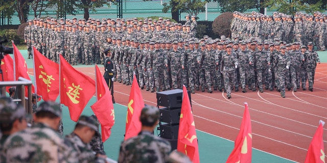 Freshmen take part in a military training at Southeast University on October 22, 2021 in Nanjing, Jiangsu Province of China.