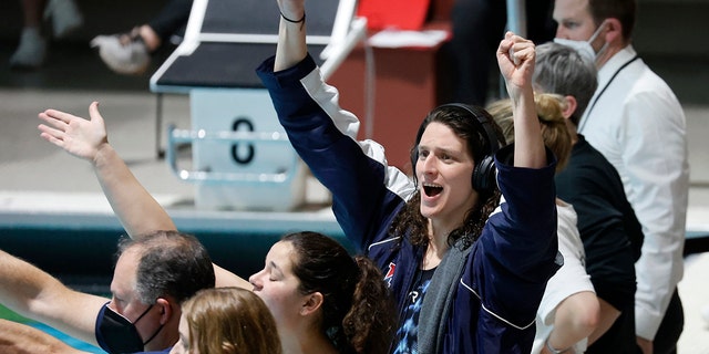 Pennsylvania's Lia Thomas cheers for teammates competing in the 1,650-yard freestyle final at the Ivy League swimming and diving championships at Harvard, Saturday, Feb. 19, 2022, in Cambridge, Massachusetts. 