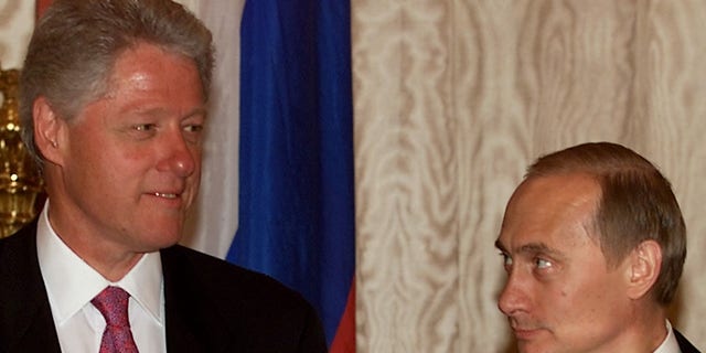 Russian President Vladimir Putin (R) looks at U.S. President Bill Clinton (L) before the start of their second meeting June 4 in Catherine's Hall in the Kremlin. WM