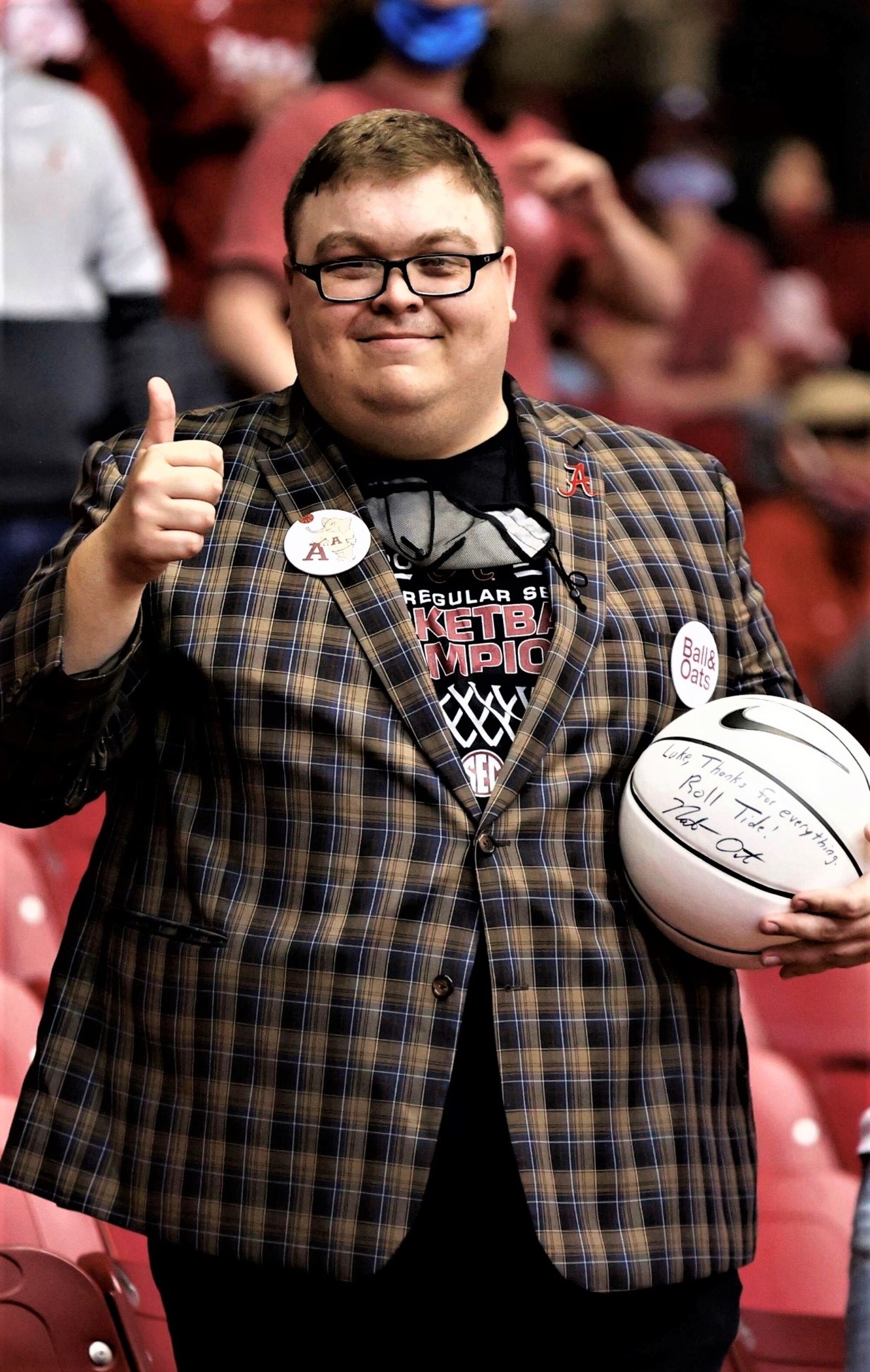 Luke Ratliff, in costume as Fluff, gives a thumbs up.