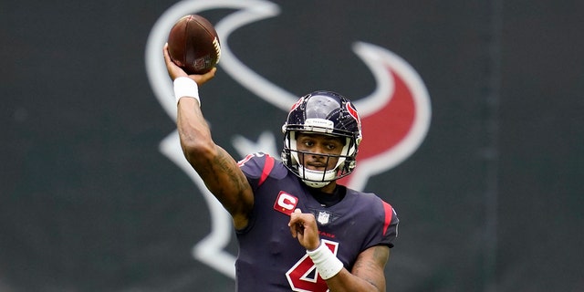 FILE - In this Dec. 27, 2020, file photo, Houston Texans quarterback Deshaun Watson throws a pass during an NFL football game against the Cincinnati Bengals in Houston. New Houston Texans coach David Culley reiterated Thursday, March 11, 2021, that the team has no intention of trading Watson, despite the star quarterback’s request to be dealt.