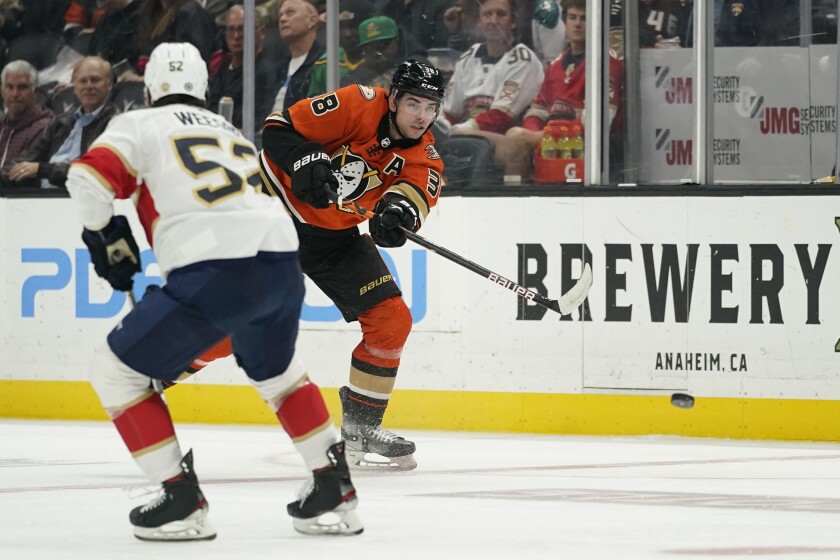 Ducks center Derek Grant (38) shoots against Panthers defenseman MacKenzie Weegar (52) in the second period March 18, 2022.