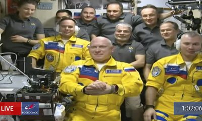 Russian cosmonauts wear Ukrainian colors in arrival at International Space Station