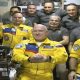 Russian cosmonauts wear Ukrainian colors in arrival at International Space Station