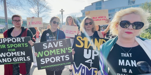 Feminists protest transgender woman Lia Thomas of the University of Pennsylvania's participation in the NCAA Division I swimming and diving championships. 