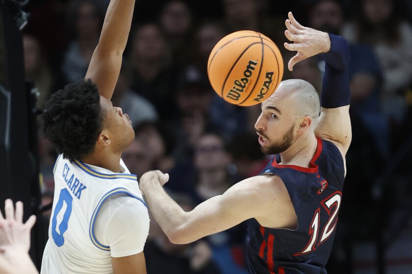 UCLA's Jaylen Clark defends St. Mary's Tommy Kuhse during the first half March 19, 2022, in Portland, Ore. 