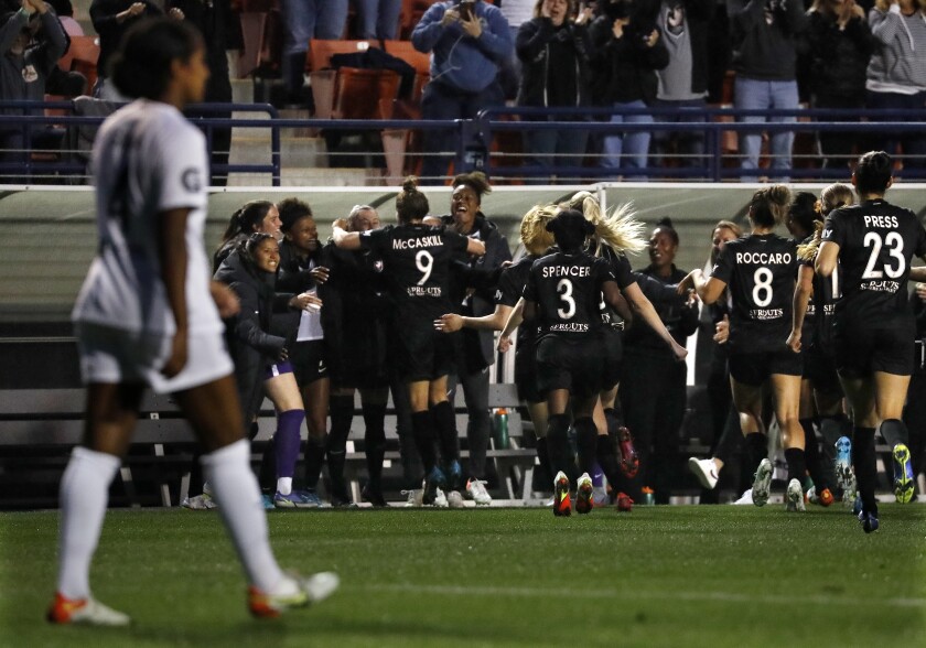 Angel City players celebrate the first goal in franchise history against the San Diego Wave on Saturday.