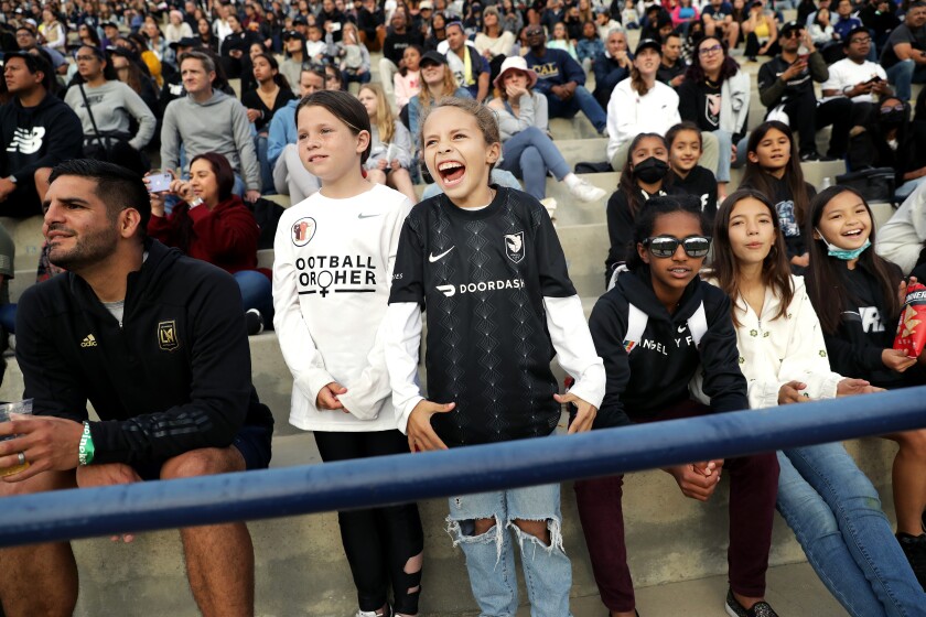 Young soccer players Parker Schumacher, left, and Taylor Mendoza attend Angel City's match.