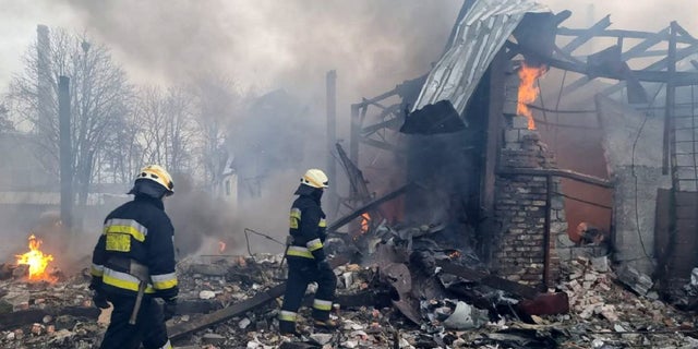 Firefighters at a site after airstrikes hit civil settlements as Russian attacks continue on Ukraine in Dnipro, Ukraine, March 11, 2022. 