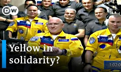 Russian cosmonauts board the ISS wearing blue and yellow suits | DW News