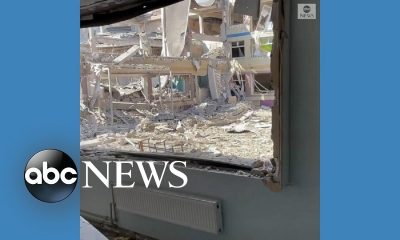 Former student walks through destroyed school in Ukraine