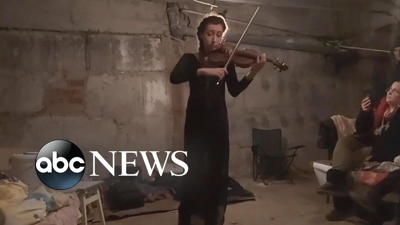 Ukrainian woman plays violin from apartment basement in Kharkiv