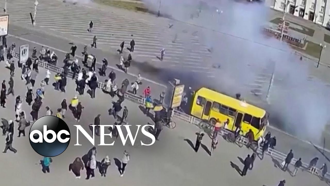 Pro-Ukrainian demonstrators scatter as Russian troops open fire