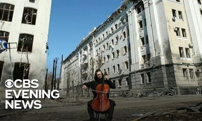 Ukrainian cellist performs in front of bombed building