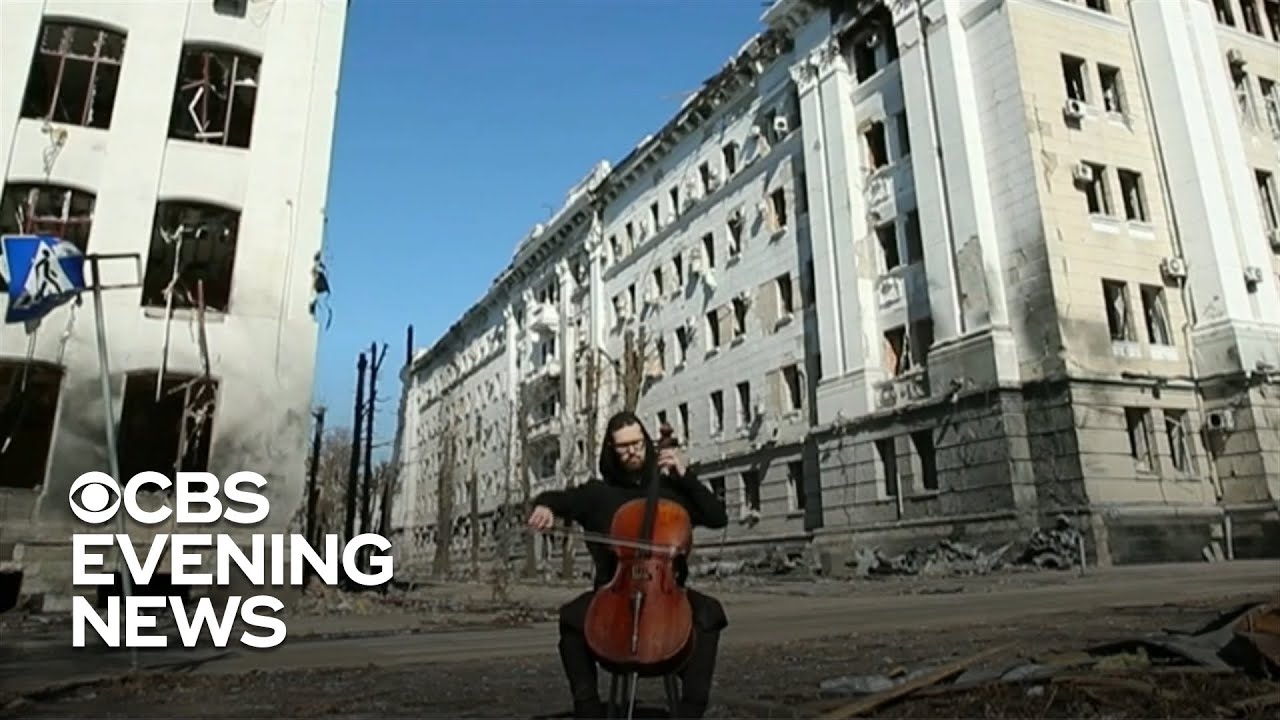 Ukrainian cellist performs in front of bombed building