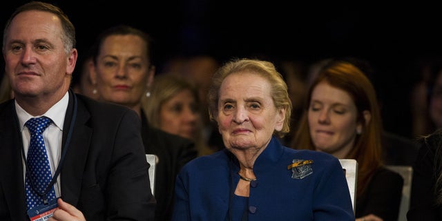 Former Secretary of State Madeleine Albright sits next to New Zealand's Prime Minister John Key during the Clinton Global Initiative's annual meeting in New York, Sept. 29, 2015.