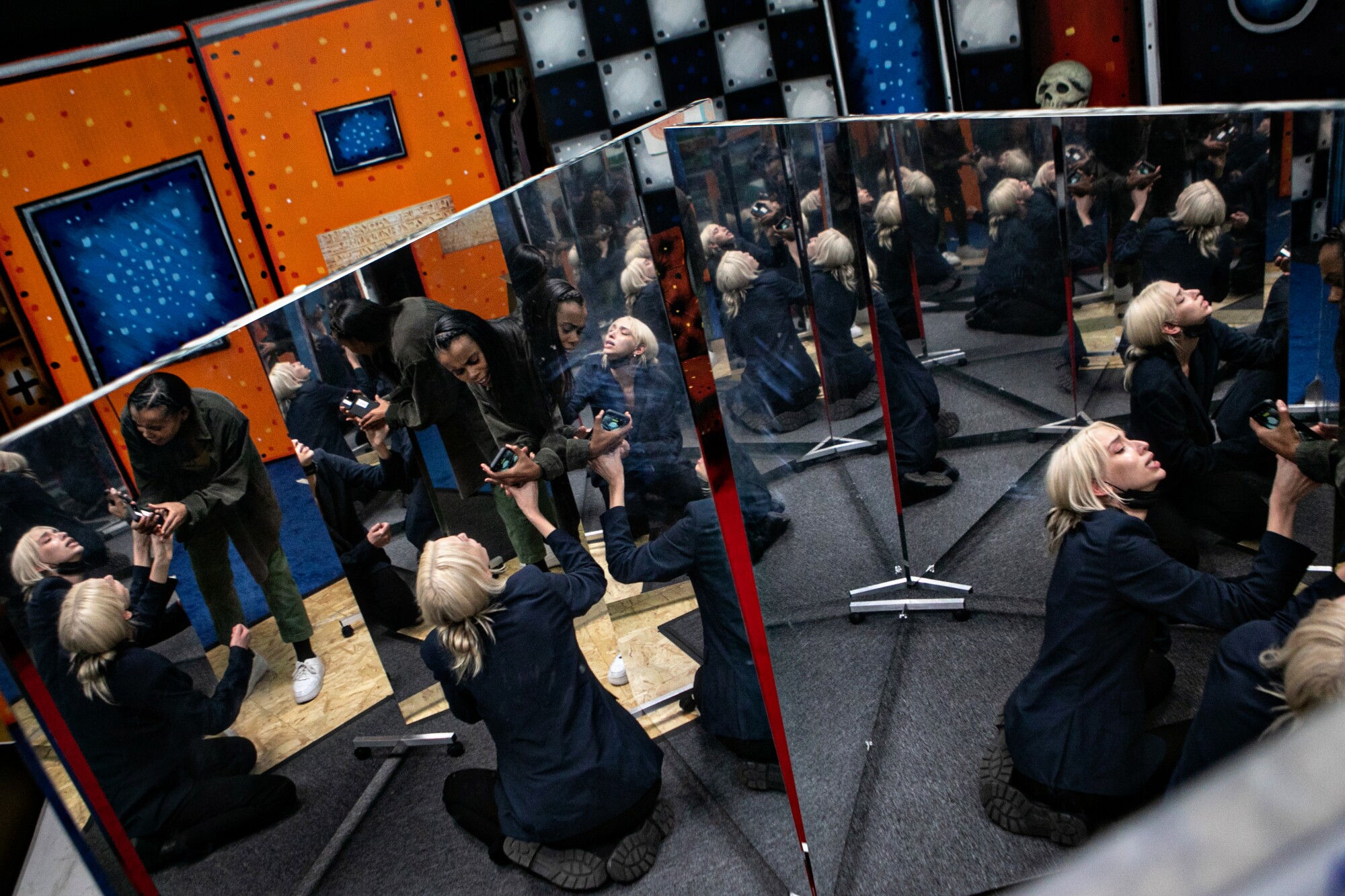 Sarah Coffey, seated, and Sydney Battle perform inside a room of mirrors during dress rehearsals of "Stapleview." 