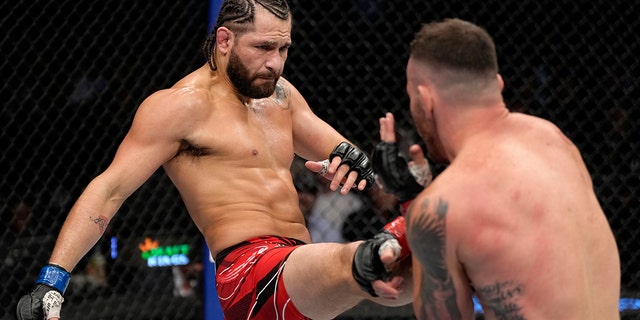 Jorge Masvidal kicks Colby Covington in their welterweight fight during the UFC 272 event March 5, 2022, in Las Vegas.