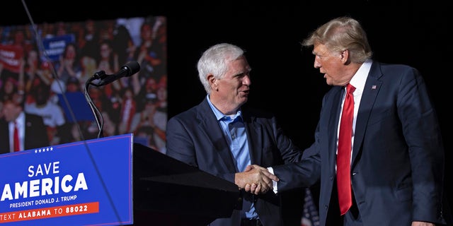 Former President Trump welcomes candidate for U.S. Senate and U.S. Rep. Mo Brooks, R-Ala., to the stage during a "Save America" rally at York Family Farms on Aug. 21, 2021, in Cullman, Alabama.