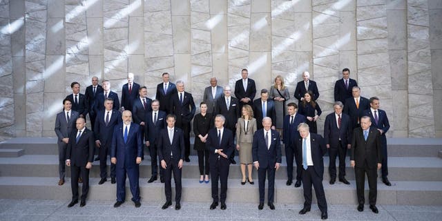 First row from right, Turkey's President Recep Tayyip Erdogan, Britain's Prime Minister Boris Johnson, U.S. President Joe Biden, NATO Secretary General Jens Stoltenberg, Belgium's Prime Minister Alexander De Croo and leaders of the US-led military alliance, pose for a family photo at NATO Headquarters in Brussels, Thursday, March 24, 2022. 