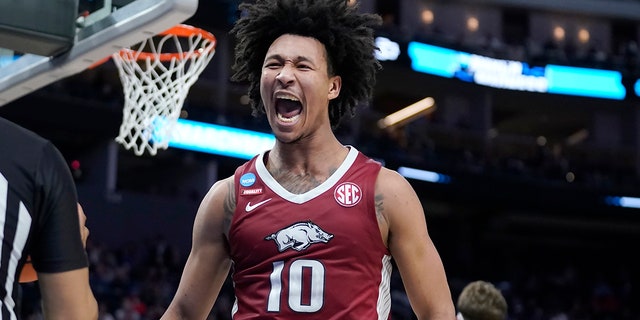 Arkansas forward Jaylin Williams reacts after dunking against Gonzaga during the first half of a college basketball game in the Sweet 16 round of the NCAA tournament in San Francisco, Thursday, March 24, 2022.