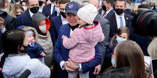 President Biden meets with Ukrainian refugees and humanitarian aid workers during a visit to PGE Narodowy Stadium, Saturday, March 26, 2022, in Warsaw.