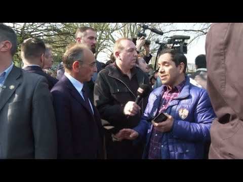 Water bottles rain down on far-right candidate Zemmour during visit to Parisian 'crack camp'