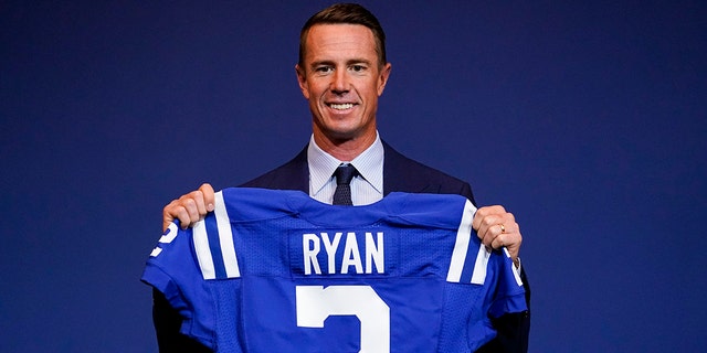 Indianapolis Colts quarterback Matt Ryan holds his new jersey following a press conference at the NFL team's practice facility in Indianapolis, Tuesday, March 22, 2022.