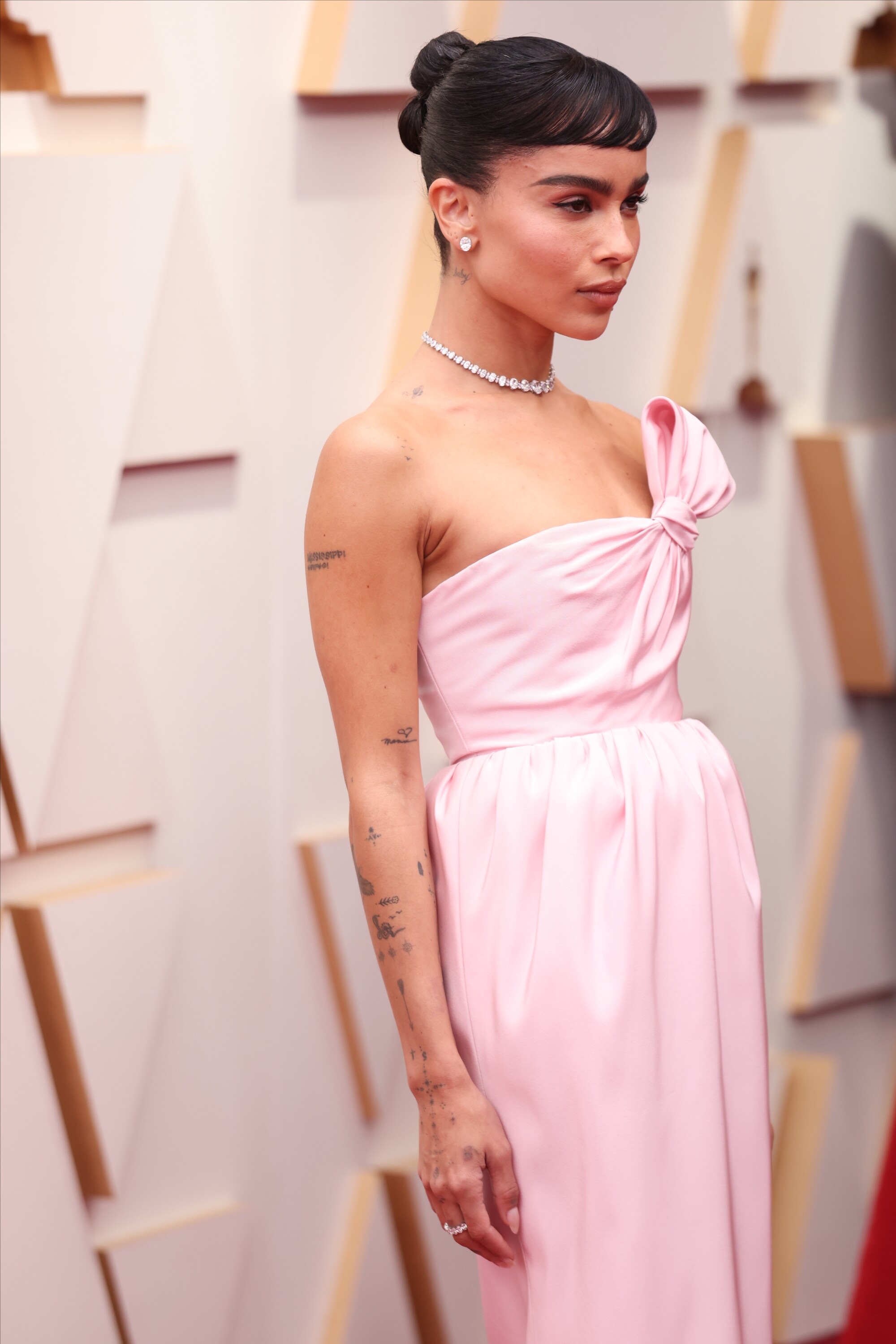 A woman in a light pink gown 