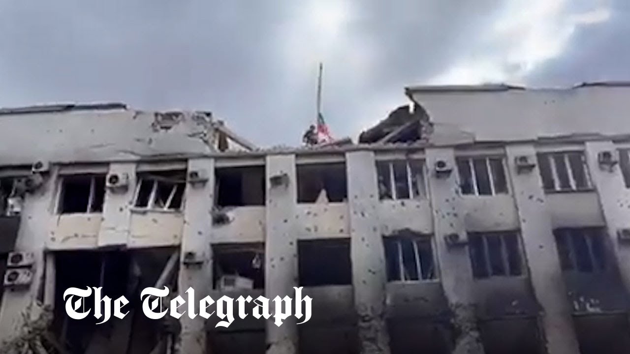 Video appears to show Russian troops raising flag on Mariupol town hall building