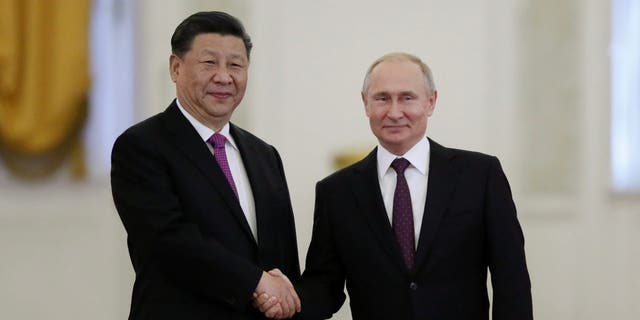 Russian President Vladimir Putin shakes hands with his Chinese counterpart Xi Jinping at the Kremlin in Moscow, Russia, June 5, 2019.