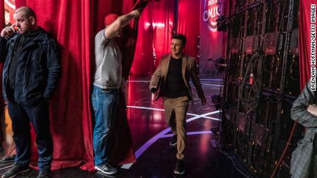 Volodymyr Zelenskiy walks backstage during the filming of his comedy show &#39;Liga Smeha&#39; (League of Laughter) in 2019.