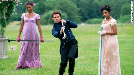 (From left) Simone Ashley as Kate Sharma, Jonathan Bailey as Lord Anthony Bridgerton, and Charithra Chandran as Edwina Sharma are shown in &quot;Bridgerton.&quot; 