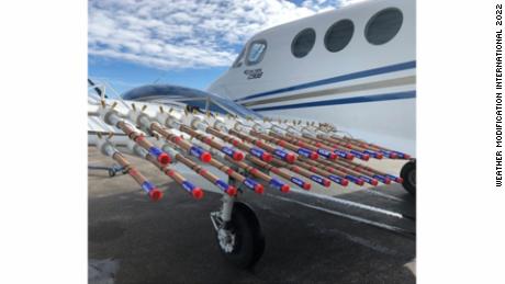 This photo shows flares fixed on the aircraft&#39;s wing that house the silver iodide used for cloud seeding.