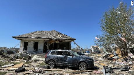 Crews comb through devastated neighborhoods in the New Orleans area after a tornado kills 1 and leaves thousands without power