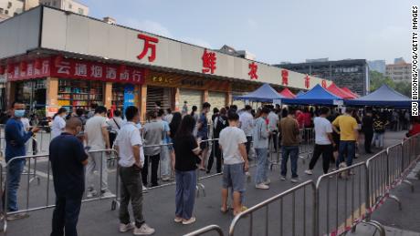  People line up for nucleic acid testing at a temporary Covid-19 testing site on March 22, 2022 in Shenzhen.