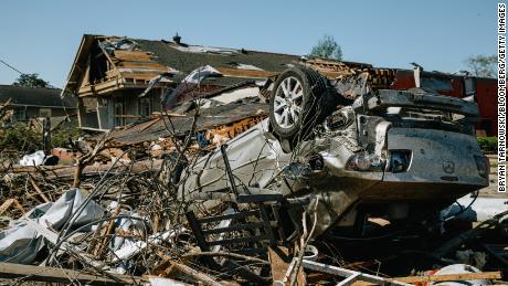 An overturned vehicle is seen Wednesday amid destroyed homes in Arabi, Louisiana.