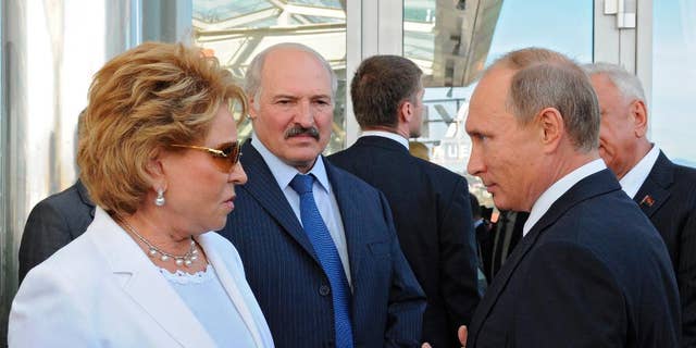 Russian President Vladimir Putin, right, Belarusian President Alexander Lukashenko, second left, and Upper House Speaker Valentina Matviyenko, left, visit the Sirius college for gifted children in the Black Sea resort of Sochi, Russia, Friday, Sept. 18, 2015. 