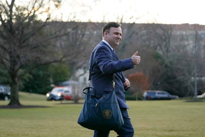 White House social media director Dan Scavino walks to board Marine One on the South Lawn of the White House on Jan. 20, 2021, in Washington. The House committee investigating the Jan. 6 attack on the U.S. Capitol is pushing ahead with contempt charges against former Trump advisers Peter Navarro and Dan Scavino in response to their monthslong refusal to comply with subpoenas.