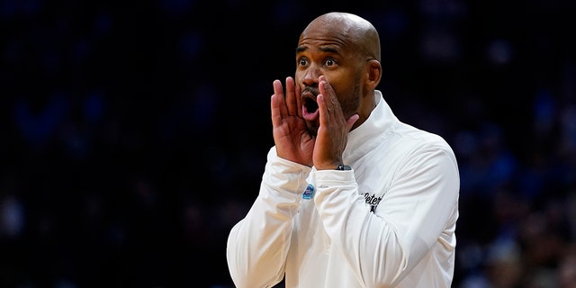 St. Peter's head coach Shaheen Holloway reacts during the first half of a college basketball game against North Carolina in the Elite 8 round of the NCAA tournament, Sunday, March 27, 2022, in Philadelphia.