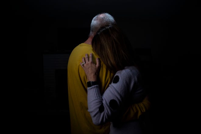 Chris Etheridge and Tracy Etheridge hold each other in their living room in Waverly, Tenn., Thursday, March 10, 2022. The two recently married after Chris Etheridge saved Tracy from drowning in floodwaters in the flood that hit Waverly six months ago.
”In the middle of the flood, we thought we were going to die,” Tracy Etheridge said, “And I remember he kissed me on the forehead.” 