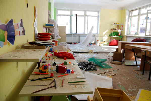 Children’s tables covered in debris and art.